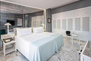 Postel nebo postele na pokoji v ubytování AZZ Mérida Medea Hotel