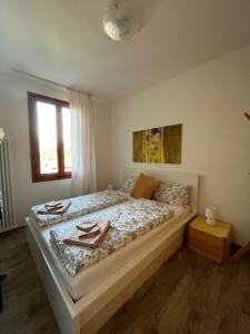 a bedroom with a bed with a tray on it at Apartment Claudia Malcesine in Malcesine +24 photos