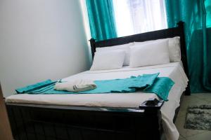 Ένα ή περισσότερα κρεβάτια σε δωμάτιο στο Ella homes
