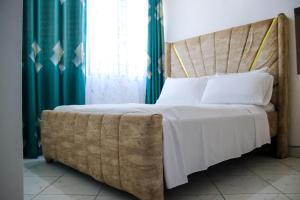Ένα ή περισσότερα κρεβάτια σε δωμάτιο στο Ella homes