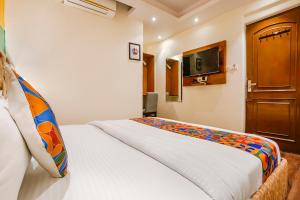 Postel nebo postele na pokoji v ubytování FabHotel Twigo Inn