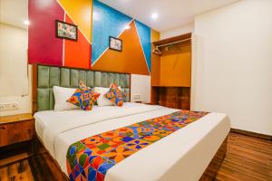 Postel nebo postele na pokoji v ubytování FabHotel Twigo Inn