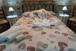 Postel nebo postele na pokoji v ubytování Apartamentos Rurales La Casa de Luis