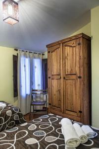 Postel nebo postele na pokoji v ubytování Apartamentos Rurales La Casa de Luis