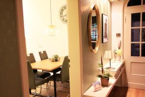 a dining room with a table and chairs at Villa Kolck in Xanten