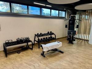a room with a gym with several rows of equipment at Wave Family Apartment E997 - Resort & SPA - SEA VIEW in Międzyzdroje