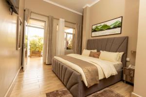 Giường trong phòng chung tại Inganzo Boutique Hotel
