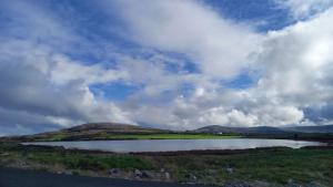 a large body of water under a cloudy sky at The Old Schoolhouse in New Quay