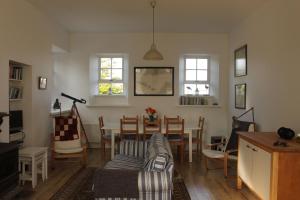 a living room with a couch and a table at The Old Schoolhouse in New Quay