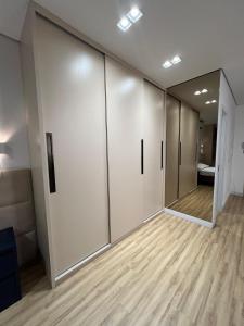 a row of lockers in a room with wood floors at LK Santo Agostinho 6 in Belo Horizonte +33 photos