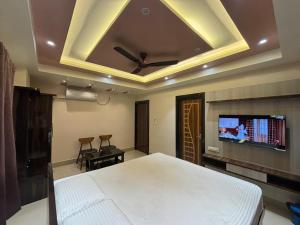 Un televizor și/sau centru de divertisment la SR Hotel