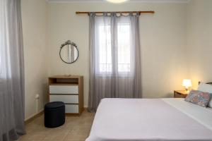 Postel nebo postele na pokoji v ubytování Adonino Apartment