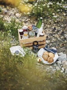 a crate of food sitting on the ground next to a table at Sun Lodge Schladming by Schladming-Appartements in Schladming +32 photos