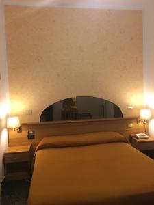 Postel nebo postele na pokoji v ubytování Hotel Villa Camilla