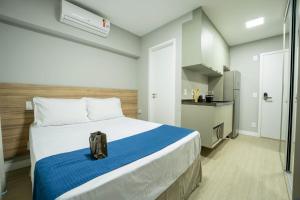 Apartamentos Studio Allure Moema - Com café da manhã opcional, Recepção e Valet 24 horas客房内的一张或多张床位