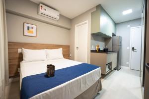 Apartamentos Studio Allure Moema - Com café da manhã opcional, Recepção e Valet 24 horas客房内的一张或多张床位