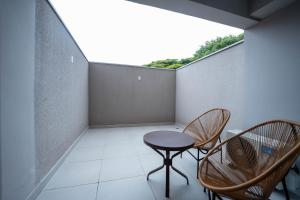 Apartamentos Studio Allure Moema - Com café da manhã opcional, Recepção e Valet 24 horas的阳台或露台