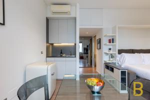 Posteľ alebo postele v izbe v ubytovaní BePlace Garibaldi Suites