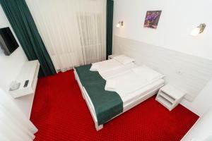 Postel nebo postele na pokoji v ubytování Hotel Cirus