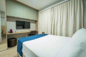 Apartamentos Studio Allure Moema - Com café da manhã opcional, Recepção e Valet 24 horas客房内的一张或多张床位