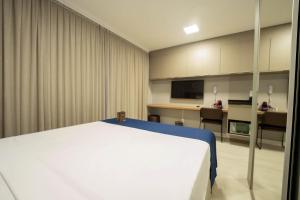 Apartamentos Studio Allure Moema - Com café da manhã opcional, Recepção e Valet 24 horas客房内的一张或多张床位