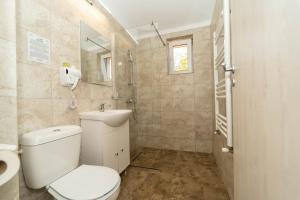 Koupelna v ubytování Hotel Cirus