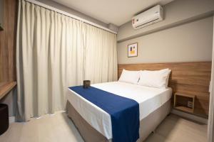 Apartamentos Studio Allure Moema - Com café da manhã opcional, Recepção e Valet 24 horas客房内的一张或多张床位