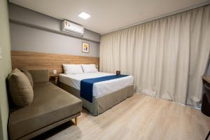 Apartamentos Studio Allure Moema - Com café da manhã opcional, Recepção e Valet 24 horas客房内的一张或多张床位