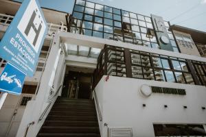 a building with stairs in front of a building at Hotel Club del Golf in Mar del Plata