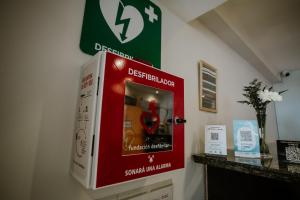 a drink dispenser on the wall of a room at Hotel Club del Golf in Mar del Plata
