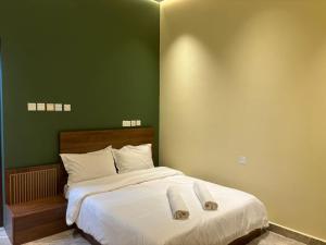 Letto o letti in una camera di Al Bayan Palms