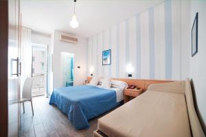 Postel nebo postele na pokoji v ubytování Hotel Bisanzio