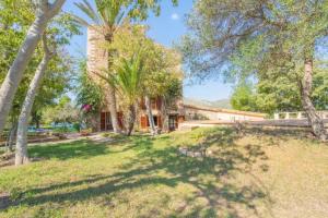 an image of a house with trees in the yard at Finca Son Xona in Capdepera