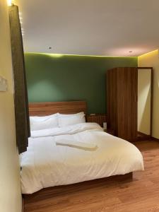 Letto o letti in una camera di Al Bayan Palms