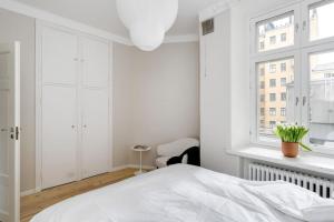 Postel nebo postele na pokoji v ubytování Apartment in Kamppi + 9 fotografií