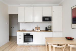 Kuchyň nebo kuchyňský kout v ubytování Apartment in Kamppi