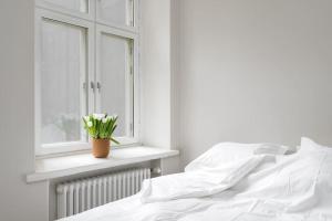 Postel nebo postele na pokoji v ubytování Apartment in Kamppi