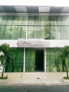 a building with a sign on the front of it at Hotel Septima Avenida in Neiva