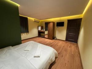 Letto o letti in una camera di Al Bayan Palms