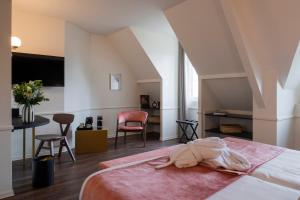 Postel nebo postele na pokoji v ubytování Hôtel La Truffe Noire + 37 fotografií