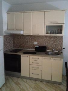 Kuchyň nebo kuchyňský kout v ubytování Flanell Apartments