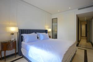 Postel nebo postele na pokoji v ubytování L'Hôtel Particulier La Marsa