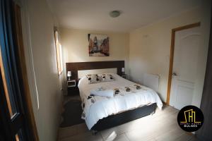 Postel nebo postele na pokoji v ubytování APART HOTEL EN BULNES