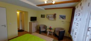 Et tv og/eller underholdning på Ferienwohnung am kleinen Bärenstein 01796 Struppen OT Thürmsdorf Thürmsdorfer Str 28