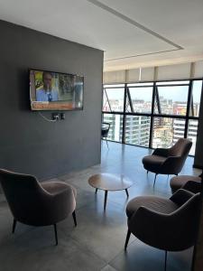 TV a/nebo společenská místnost v ubytování Time Maceió Mar
