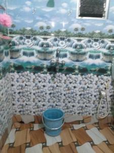 a bathroom with a painting of a bath tub at Shiv sakti homestay in kolkata +15 photos