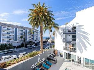 an aerial view of a building with a palm tree at Redondo Beach 1BR w Pool Gym nr Beach LAX-396 in Redondo Beach