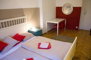 a bedroom with a bed with a red tray on it at Budget Apartment in Prague