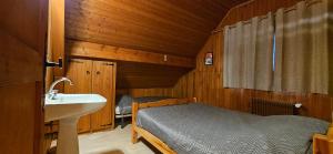 Un ou plusieurs lits dans un hébergement de l'établissement Chalet les Alpages vue panoramique sur le lac Léman