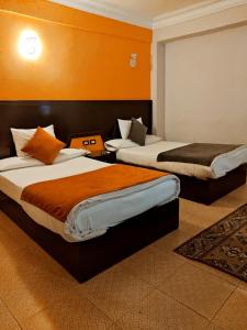 Ένα ή περισσότερα κρεβάτια σε δωμάτιο στο Red Sea Hotel